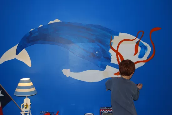 Nick painting the wall mural