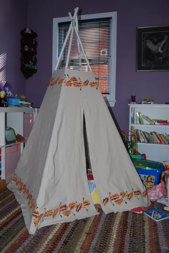 Teepee made with PVC pipe poles and painted canvas