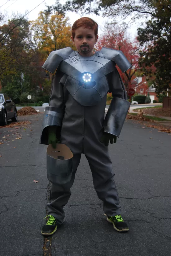 You boy dressed in a homemade, cardboard Iron Man costume